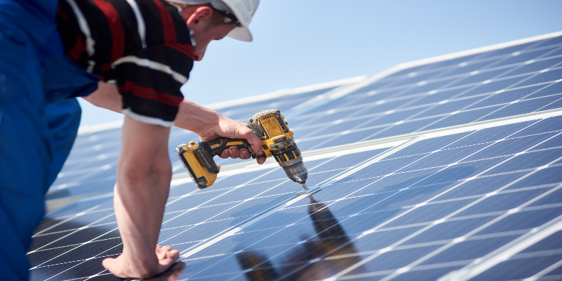 contractor installing solar panels